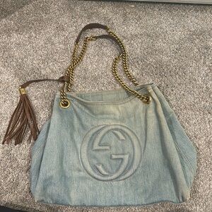Guccis shoulder denim bag